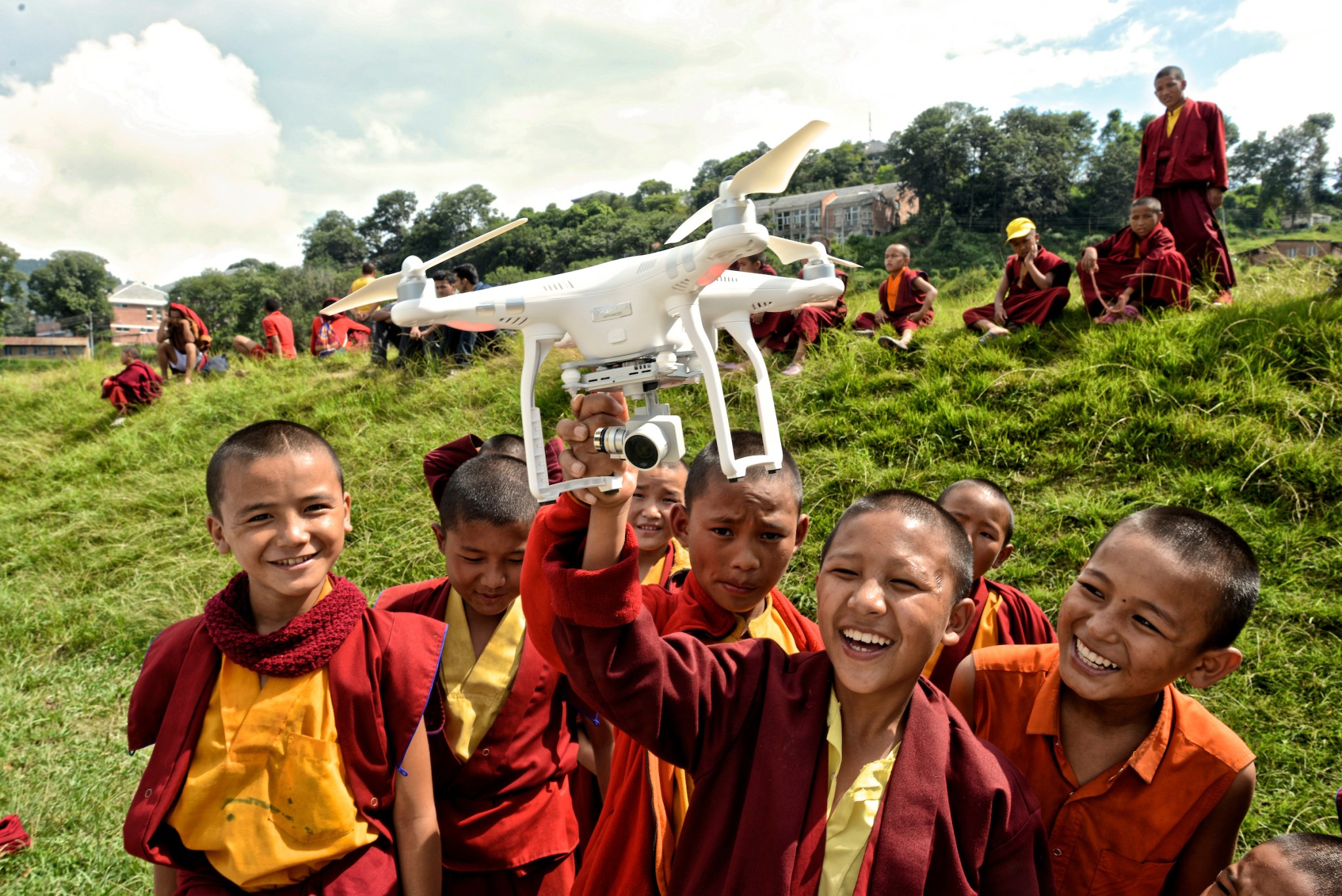 Kathmandu University students learning to operate drone equipment during a humanitarian mapping initiative in Nepal.